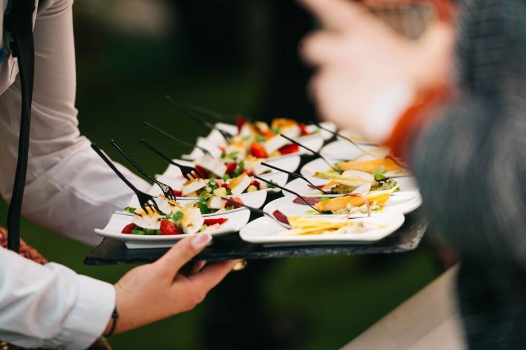 How to Start a Catering Business in Ahmedabad: A 2026 Step-by-Step Guide 7 Elegant catering event setup with gourmet food arranged on a professional serving table at a social gathering.