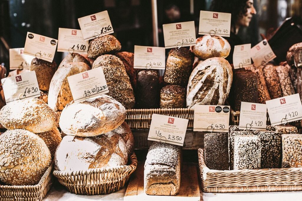 From Home Baker to Bakery Owner: A Step-by-Step Gujarat Success Roadmap 4 Home baker decorating cakes in a professional kitchen setting in India