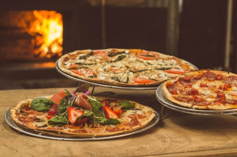 Fresh homemade Neapolitan pizza with tomato sauce and mozzarella on a wooden board