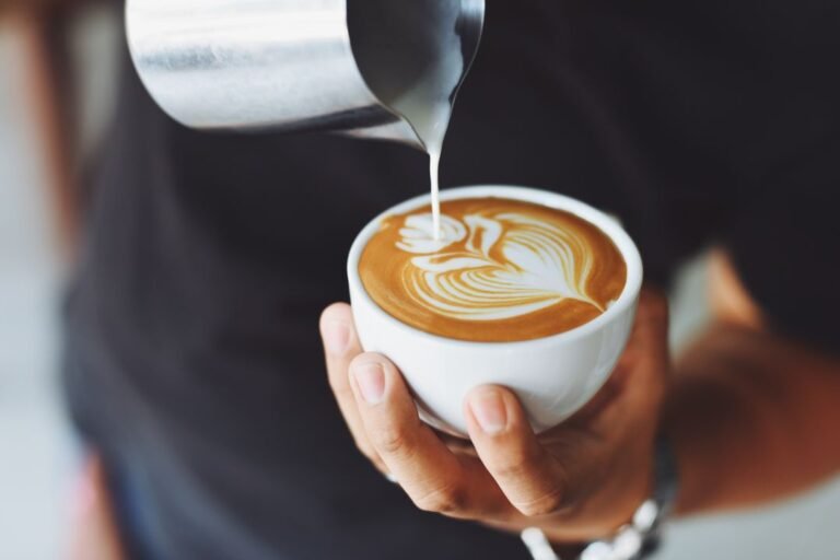 Freshly brewed coffee being poured in a modern home kitchen setting