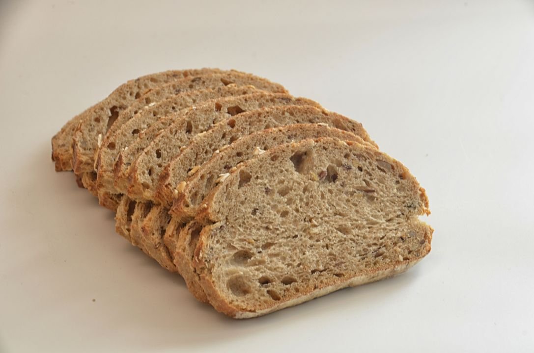 Sliced seeded wheat bread loaf