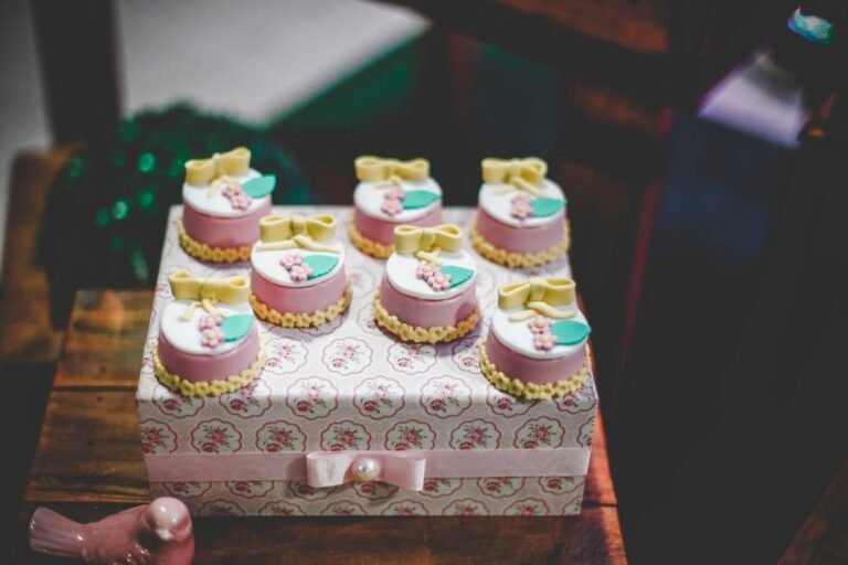 Individually decorated celebration cakes finished with floral piping.