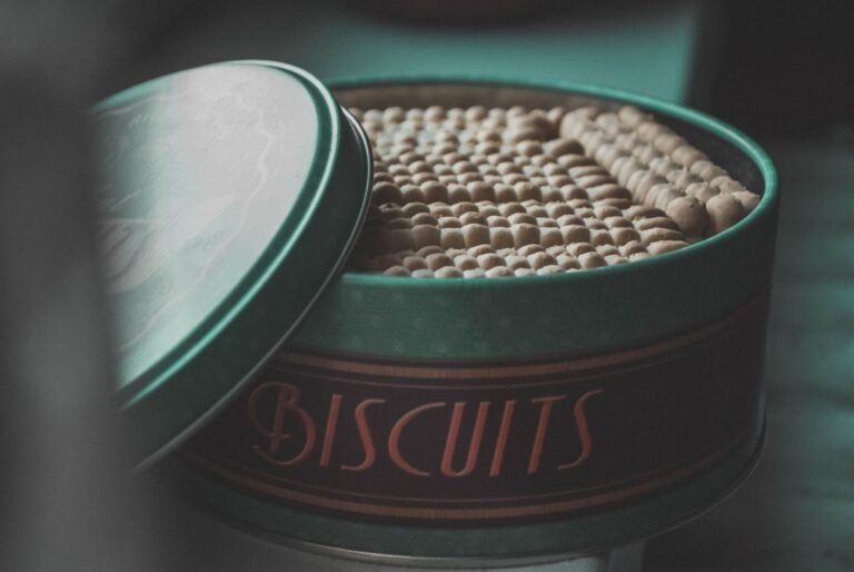 An assortment of classic butter biscuits arranged in a vintage tin.