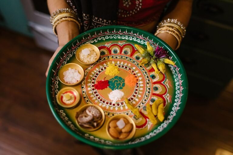 A festive Indian thali of vegetarian dishes and offerings prepared for a religious celebration.