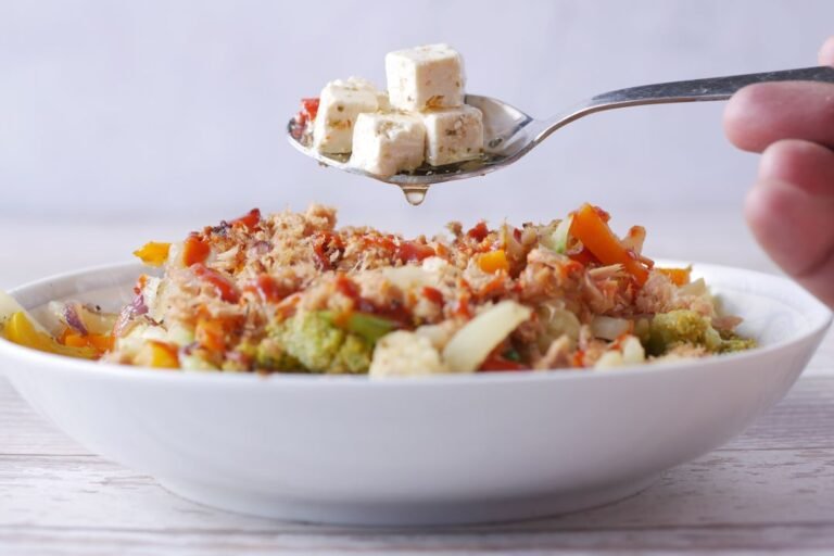 A quick vegetarian bowl of salad, tofu and vegetables prepared as a balanced weekday meal.